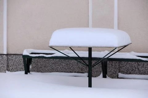 Table and Bench Covered With Snow Stock Photos