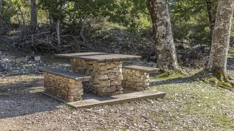 Table and bench set made out of local stone Stock Photos