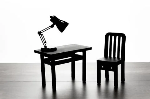 Table and chair with table lamp in black and white Stock Photos