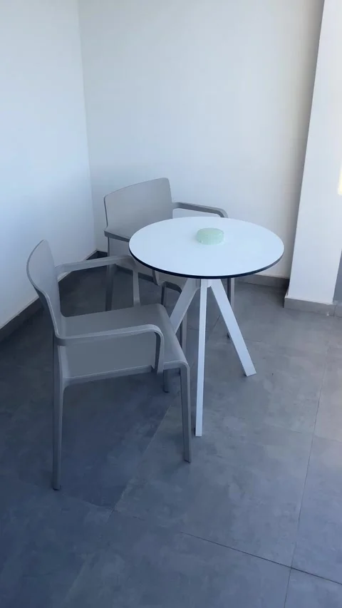 Table and chairs on the balcony. Vertical video Stock Footage 286124279