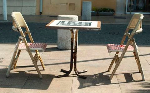 Table and chairs for chess Stock Photos