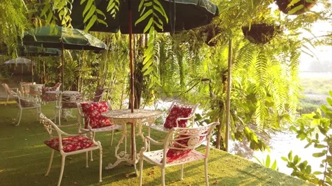 Table and chairs in garden. Stock Footage 134909776