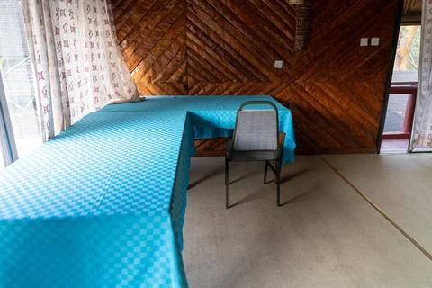 Table and chairs in an outdated conference room with nobody there Stock Photos
