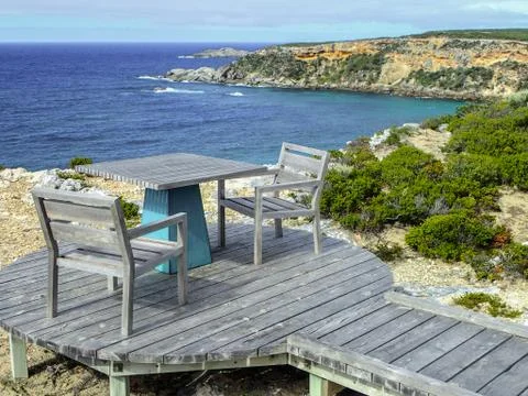 Table and chairs set up to enjoy a coastal view on Kangaroo Island, South Austra Stock Photos