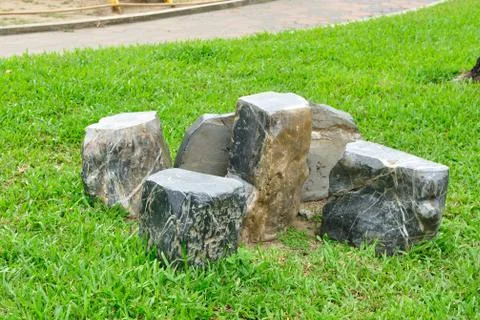 Table and chairs set made from rock. Stock Photos