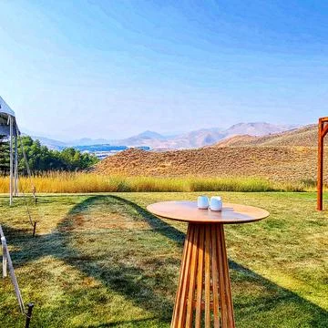 Table and cups in the mountains Stock Photos