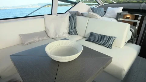 Table and sofas in the salon of a yacht Stock Footage 72299403