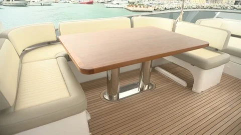 Table and sofas on upper deck of a luxury yacht Stock Footage 71827640