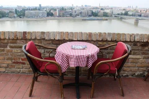 Table and two chairs in a cafe on the banks of the Danube River, Novy Sad Stock Photos