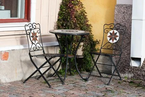 Table and two chairs Stock Photos