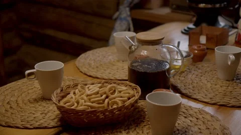 Table and utensils for tea drinking on wooden table. Stock Footage 221941619
