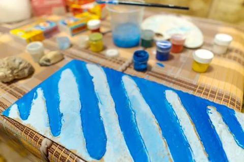 A table and workspace for creating a drawing on cardboard, artwork with blue  Stock Photos