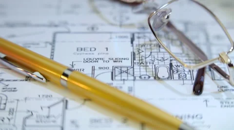 On the table of the architect is located a project  of the future home Stock Footage 49688148