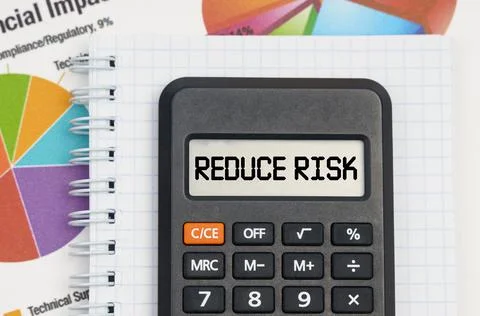On the table are charts, a notebook and a calculator with the inscription - R Stockfoto's