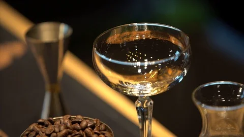 On the table are: an empty  glass, a Cup of coffee beans 스톡 동영상 105024963