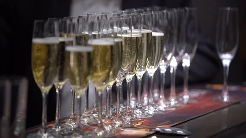 On the table are empty glasses and glasses of champagne Stock Footage 106280944