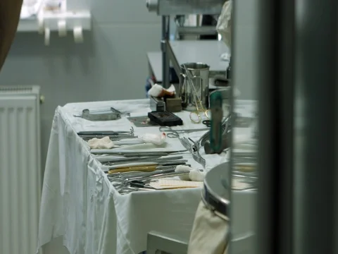 On the table are lie kit of the disinfected metal tools for surgery Stock Footage 81377705
