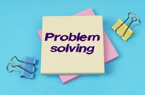 On the table are paper clips, note paper with text - Problem solving Stock Photos