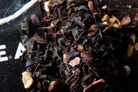 On the table are tea and tea leaves in dark colors top view Stock Photos
