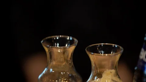 On the table are two glass containers/decanter of water and coffee 스톡 동영상 105025198