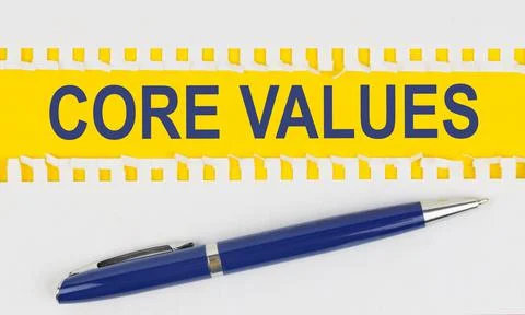 On the table are two sheets from a notebook and a pen on a yellow background  Foto stock
