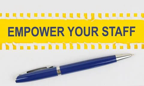 On the table are two sheets from a notebook and a pen on a yellow background  Stock Photos