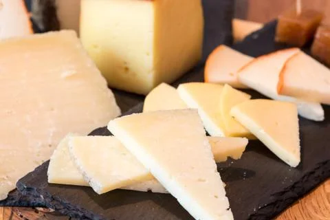 Table of assorted cheeses Stock Photos