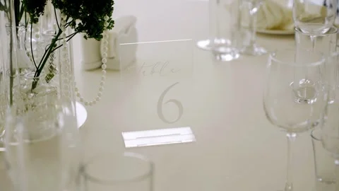 On the table at the banquet, there is a table number and other decorations Stock Footage 344670761