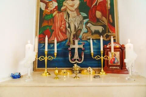 A table with baptismal objects and icons in the Armenian Church. Stock Photos