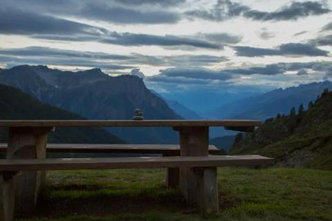 Table with a bench in the mountains, at dusk Stock-Fotos