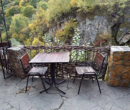 Table with benches overlooking the mountains Stock Photos