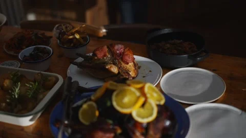 A table with a blue plate of food with oranges on it Stock Footage 295370656