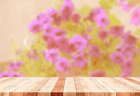 Table with blurred flowers Stock Photos