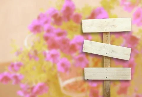 Table with blurred flowers Stock Photos