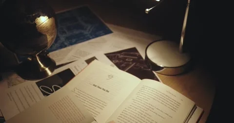 Table with books and table lamp Stock Footage 267851476