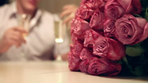 On the table is a bouquet of roses Stock Footage 57108006