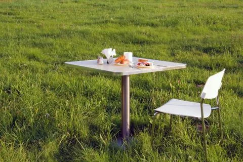 Table with breakfast at the grass Stock Photos