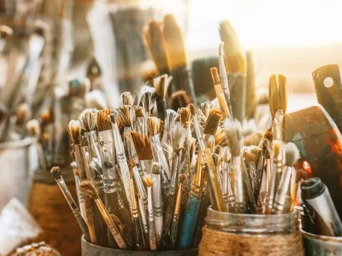 Table with brushes and tools in an art workshop. Stock Footage 128871755