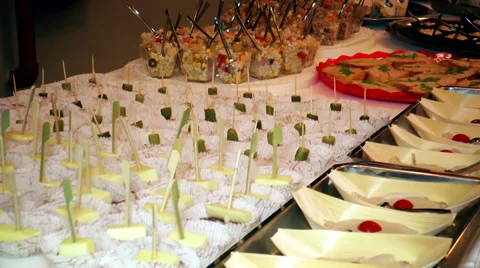 A table with a  buffet with finger foods Stock Footage 60852850