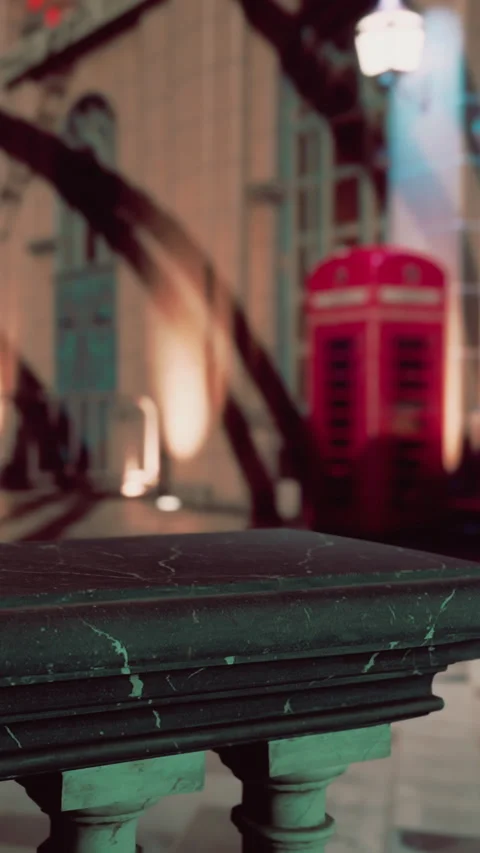 Table in a building with shadows and a red telephone box in the background Stock Footage 337973691