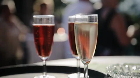 On the table is a bunch of glasses with champagne and wine. Wine tasting, some Stock Footage 204123897