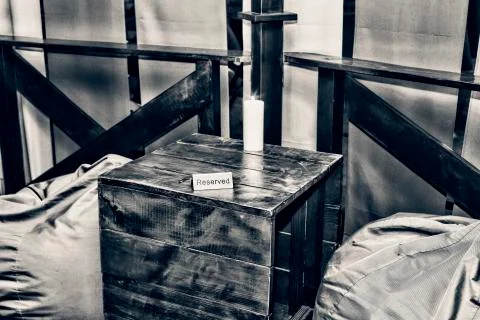 A table in a cafe with a sign reserved Фото