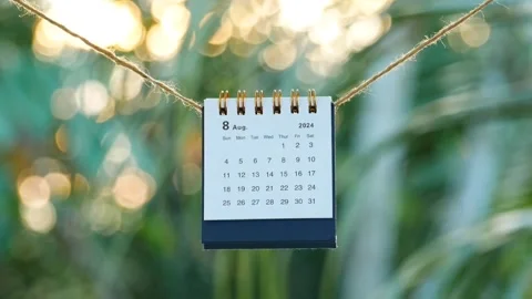 A table calendar for August 2024 hanging on a rope Stock Footage 279030618