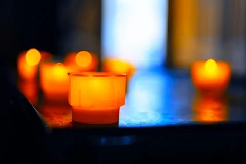 Table with candles in small cups Stock Photos