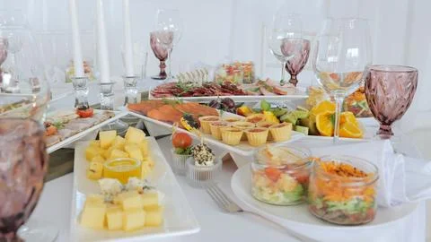 Table for a celebration or wedding reception, close-up. Luxurious interior Stock Photos