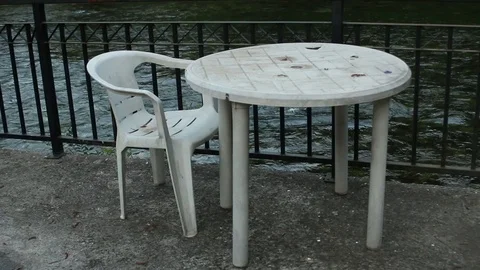 Table Chair Plastic Seat River Flow Fence Concrete Platform Old 動画素材 93604300