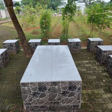 Table chairs for a gathering place in the garden Stock Photos