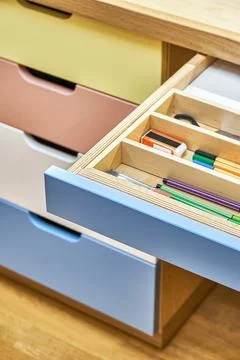 Table for children with multi-colored drawers for stationery Stock Photos