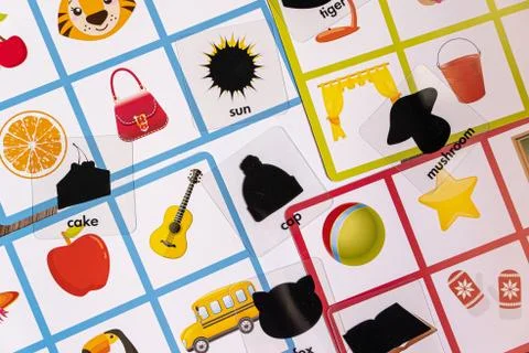 Table a children's game with pictures of objects on white background Stock Photos
