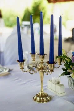 Table with a classic design. With a composition in a high vase with hydrangeas Stock Photos